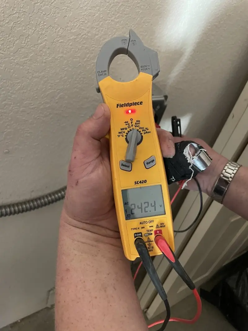Voltage testing with clamp meter during Recessed Lighting Installation in Union Grove